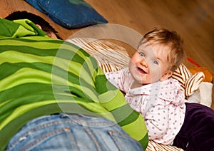 Baby girl and brother on floor