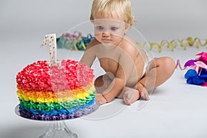 Baby girl celebrating her first bithday with gourmet cake.