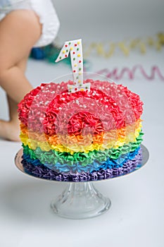 Baby girl celebrating her first bithday with gourmet cake.