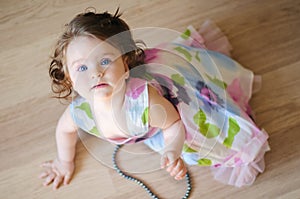 Baby-girl with chaplet photo