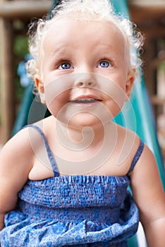 Baby, girl and child in home, happy and healthy kid alone in her house or kindergarten nursery. Face, cute blonde