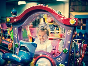 Baby girl on a choo-choo ride photo