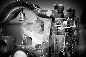 Baby girl on a choo-choo ride photo
