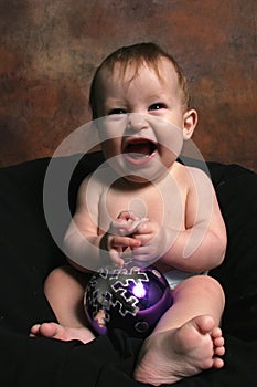 Baby Girl with Christmas Blub