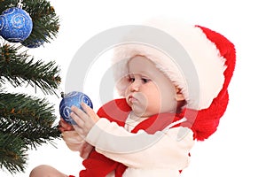 Baby girl and Christmas tree
