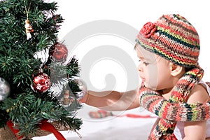 Baby girl with christmas tree