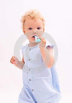 Baby girl cleans her milk teeth