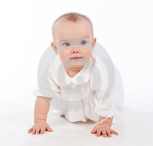 Baby girl crawling, isolated on white background