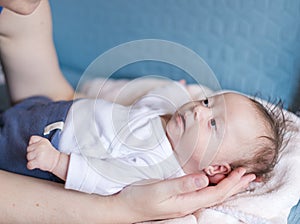 Baby Girl with Down Syndrome in Mother`s Arms