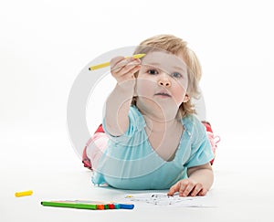 Baby girl drawing with colorful felt-tip pens