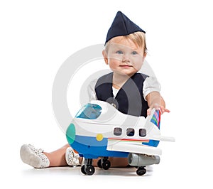 Baby girl dressed as stewardess with air plane toy
