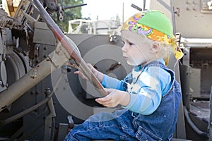 Baby girl driving an armor vehicle