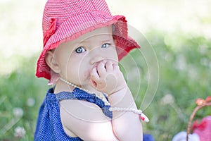 Baby girl is eating strawberrt