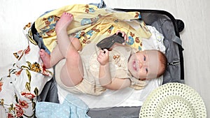 Baby girl with excited expression prepares for vacation