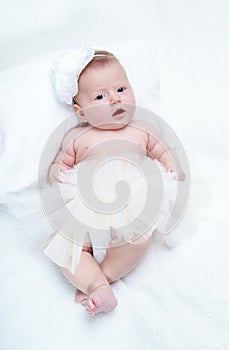 Baby girl with a flower on her head