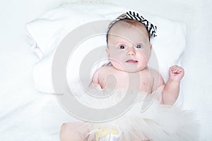 Baby girl with a flower on her head