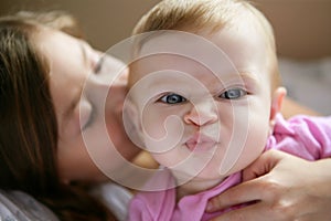 Baby girl with funny expression in face