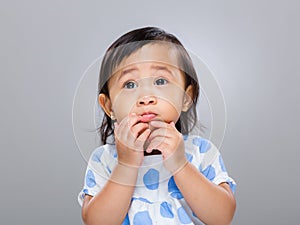 Baby girl with funny face expression