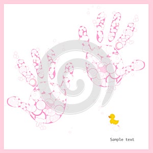 Baby girl hand prints with soap bubbles and duck