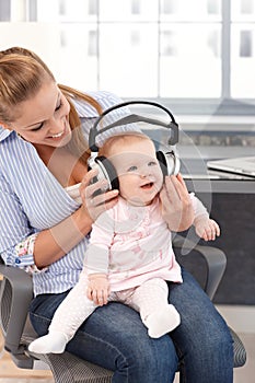 Baby girl with headphones