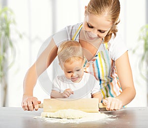Baby girl with her mother cook, bake