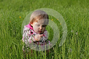 Baby girl in the high grass