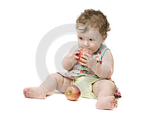 Baby girl holding big red apple