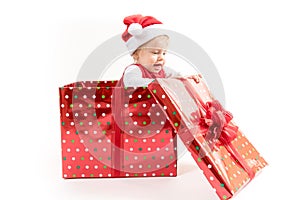 Baby Girl inside Christmas Gift Box Opens Present