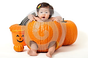 Baby girl inside the pumpkin