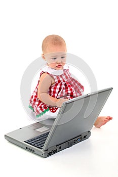 Baby Girl With Laptop Computer Over White