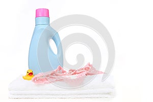 Baby Girl Laundry Items With Bottle of Detergent