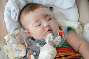 Baby Girl Laying in a Rocking Cradle