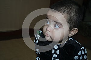 Baby girl with lovely face, big eyes and cute face gesture