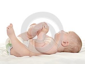 Baby girl lying on blanket