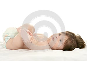 Baby girl lying in pampers