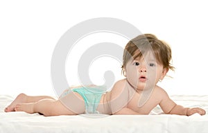 Baby girl lying in pampers