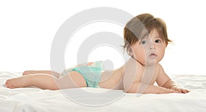 Baby girl lying in pampers