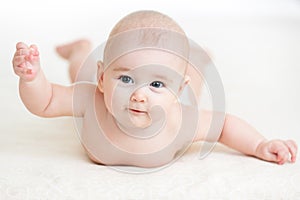 Baby girl lying smilingly photo