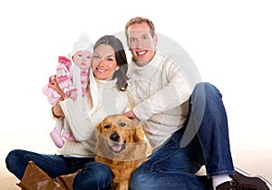 Baby girl mother and father family happy in winter and dog