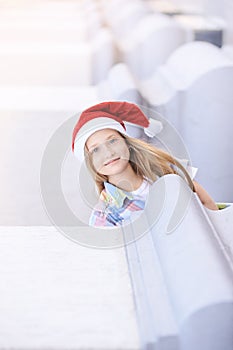 Baby girl with new year hat. christmas child smiling outdoor