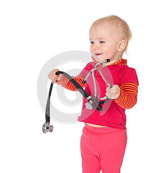 Baby girl with phonendoscope isolated on a white background