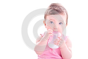 Baby girl with pink baby bottle.