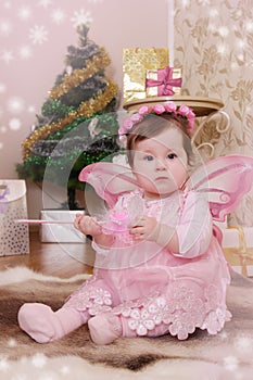 Baby girl with pink butterfly wings