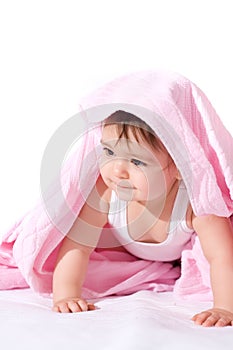 Baby girl with pink towel