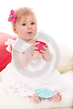 Baby girl playing with cup tea toy