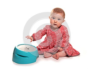 Baby girl playing with drums