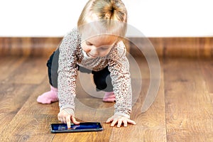Baby girl playing game on smarthphone