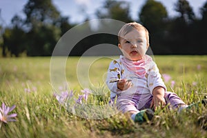 Baby Girl Playing in the Grass Field