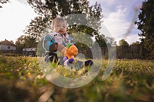 Baby Girl Playing in the Grass Field