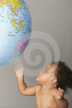 Baby Girl Playing With Inflatable Globe